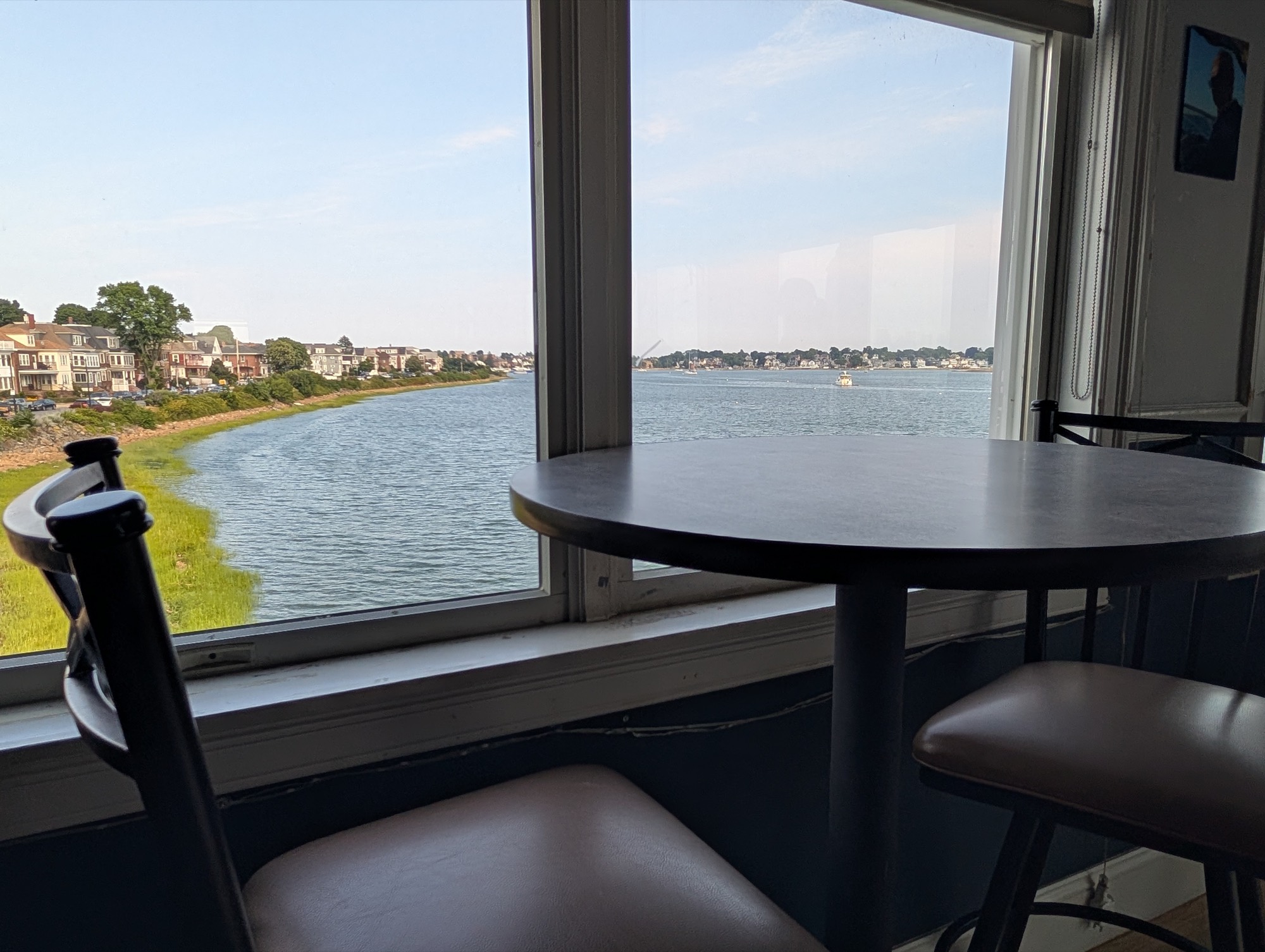 A window table in the club bar overlooking the harbor