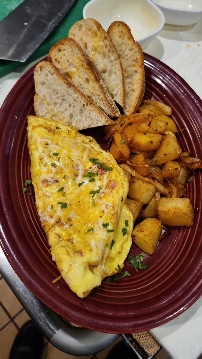 Cheese omelette with home fries and toast